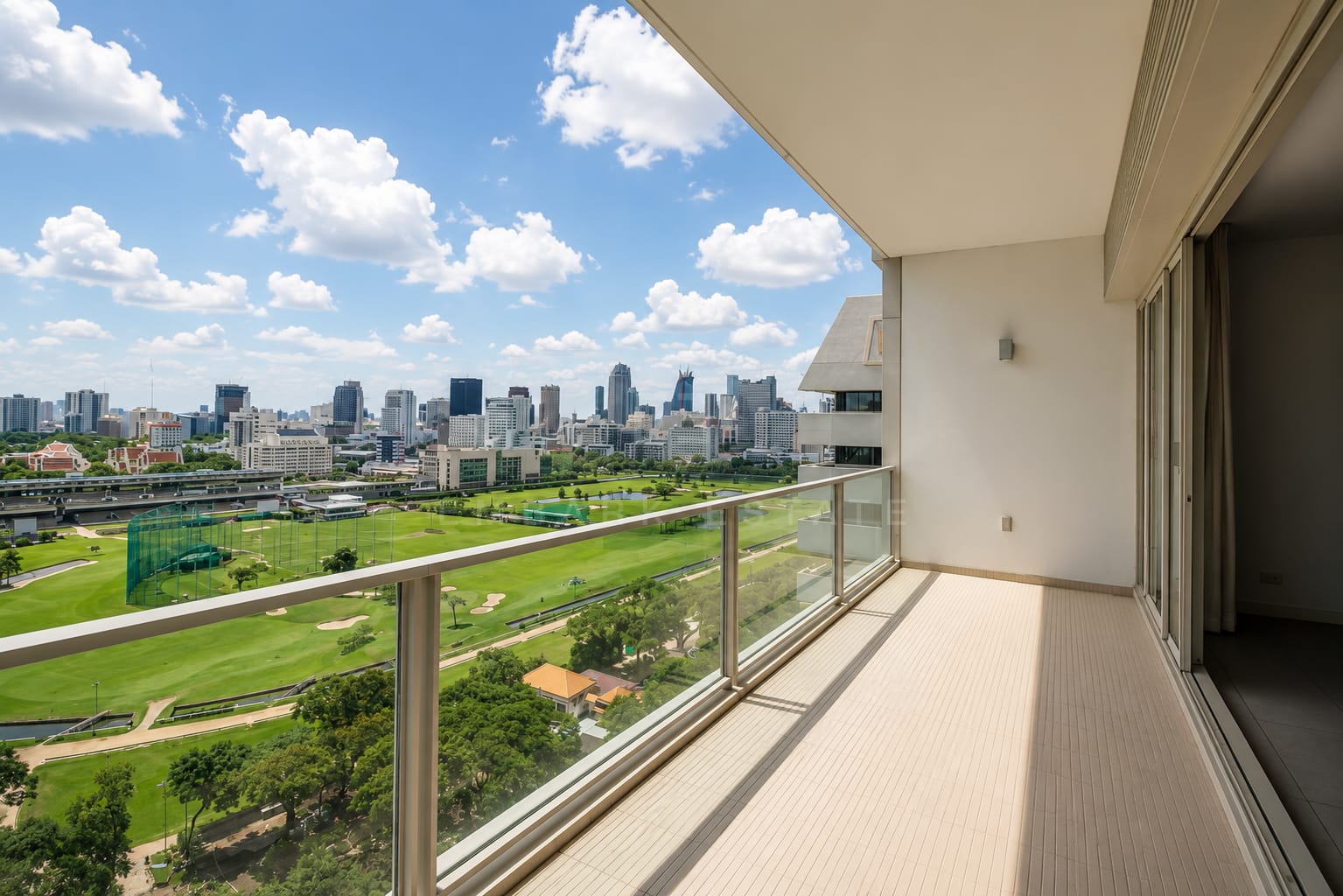 The balcony at 185 Rajadamri, running the length of the glazing above the Royal Bangkok Sports Club