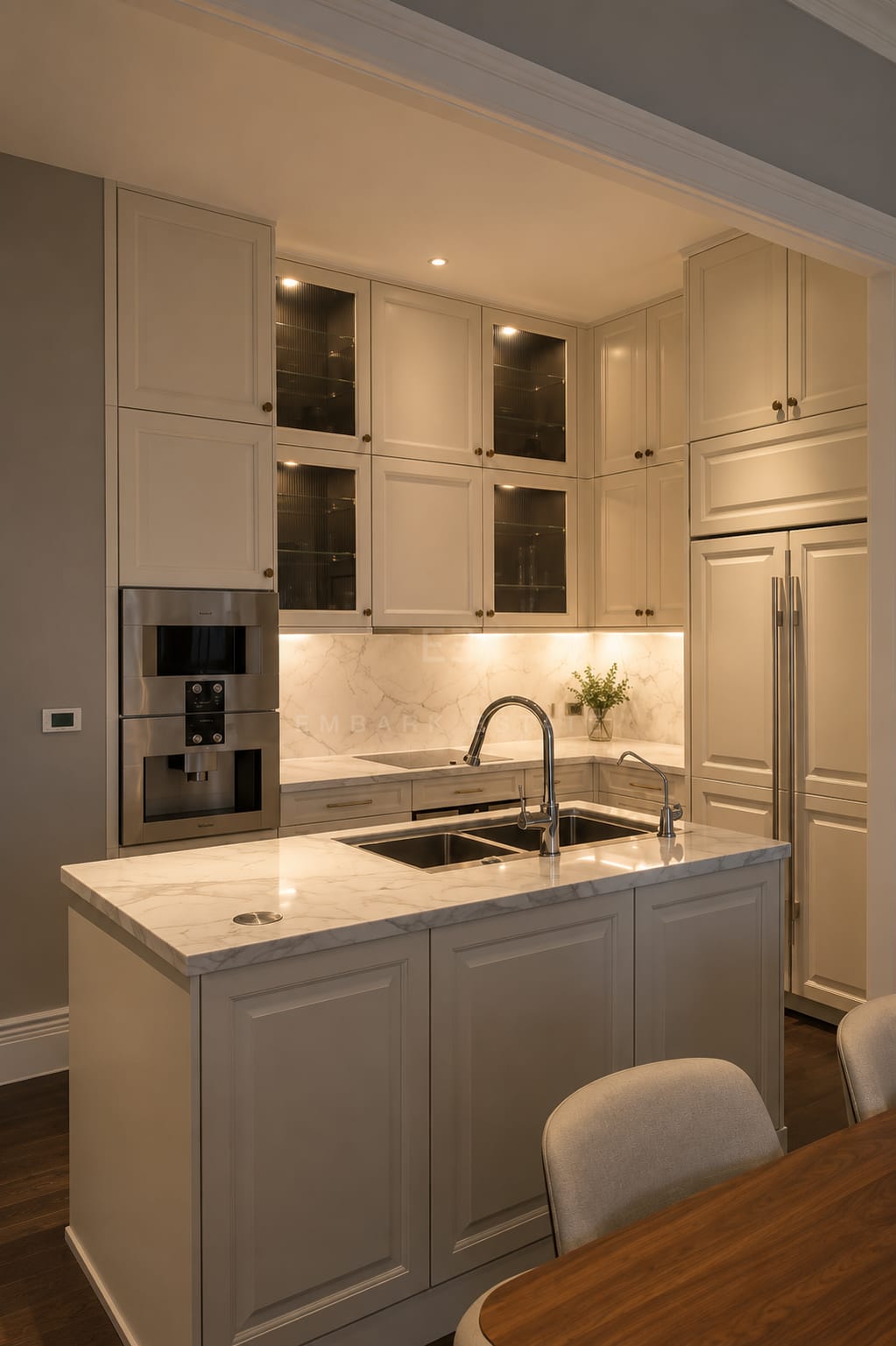 The kitchen at 98 Wireless, a marble island and panelled cabinetry with a built-in oven and coffee machine