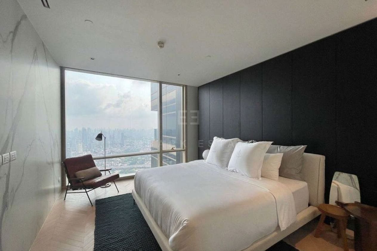 Four Seasons Private Residences Bangkok — bedroom with dark feature wall and city view