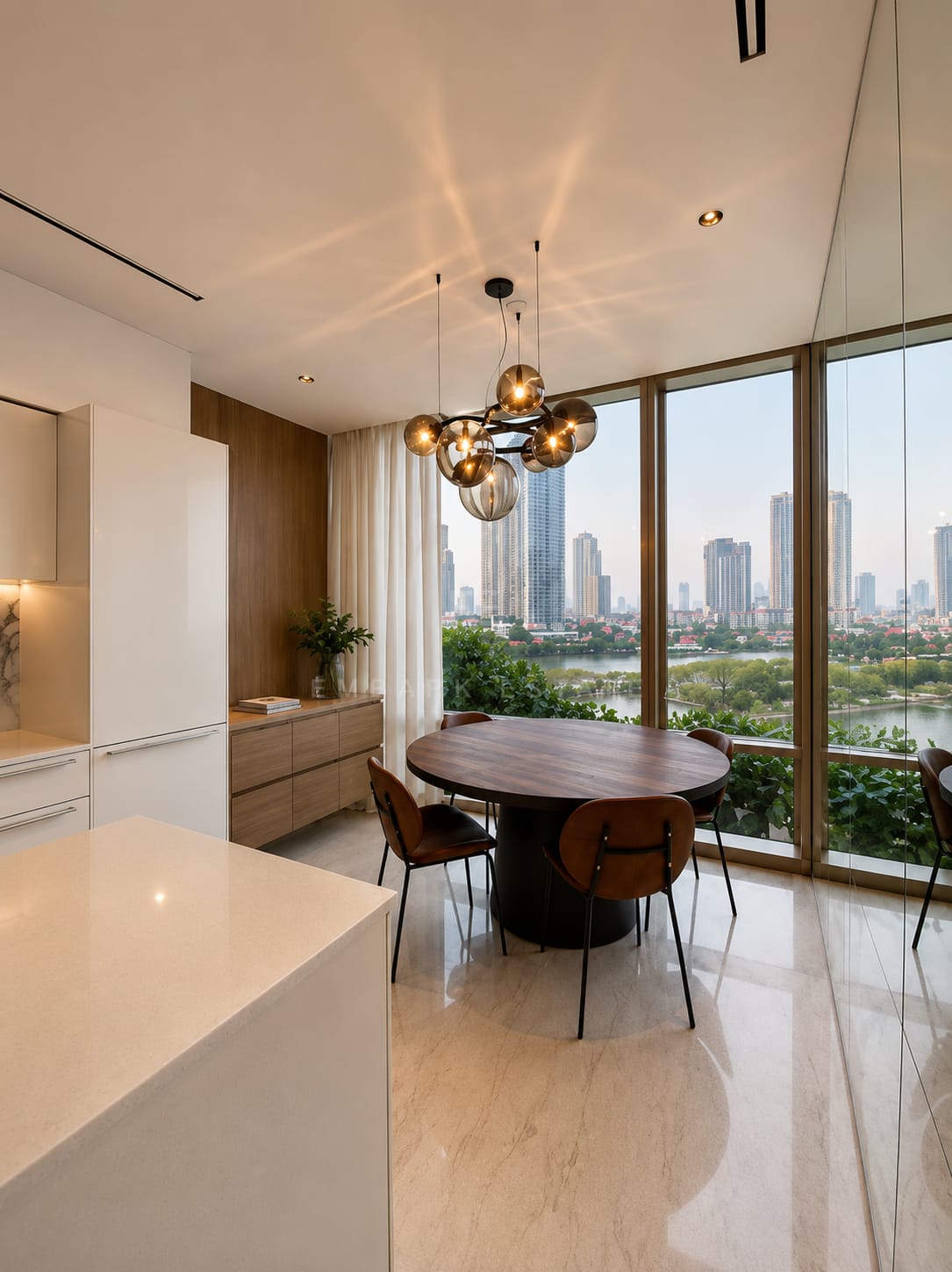 The dining table at Four Seasons Private Residences, a round timber top under a cluster of smoked glass globes with the greenery of the river bank beyond