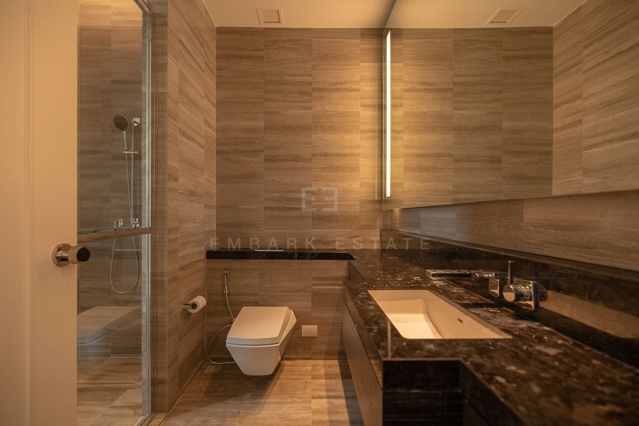 Four Seasons Private Residences Bangkok — bathroom with walk-in shower and dark marble vanity