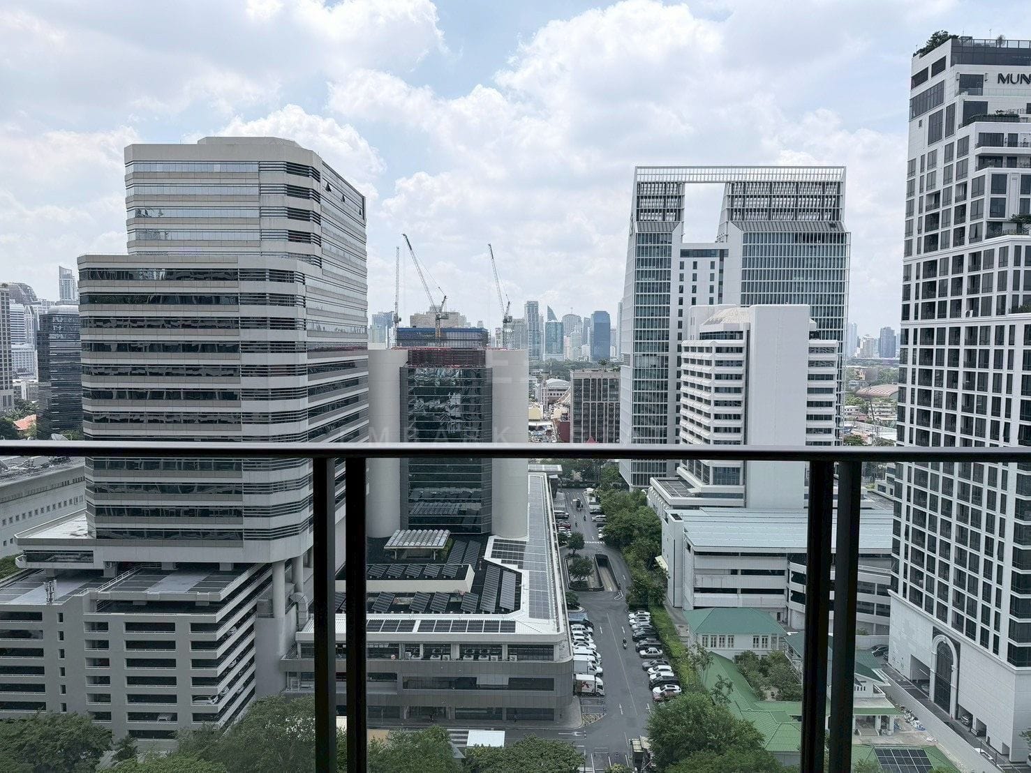 The view from the balcony at Sindhorn Kempinski over the office towers of central Bangkok