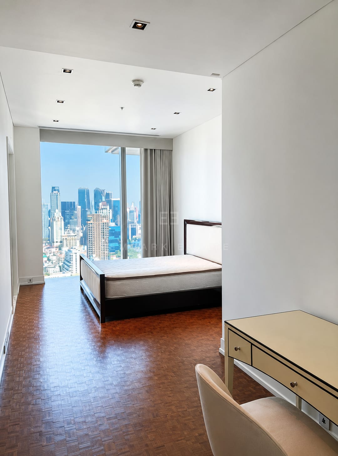 The Ritz-Carlton Residences Bangkok — master bedroom with floor-to-ceiling skyline windows