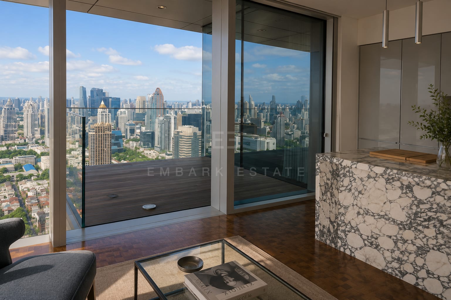 The living room at The Ritz-Carlton Residences Bangkok looking toward the kitchen, the terrace door open along the glazing