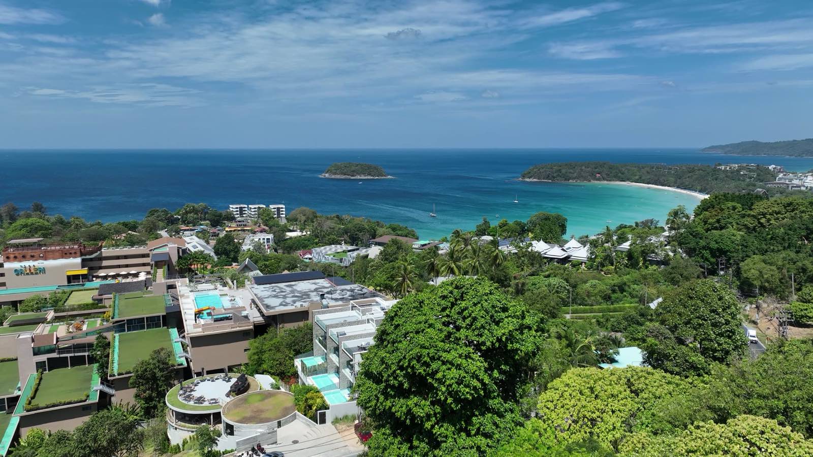 The west coast of Phuket from the air: the Bang Tao and Layan shore, where most of the island's branded residences sit.