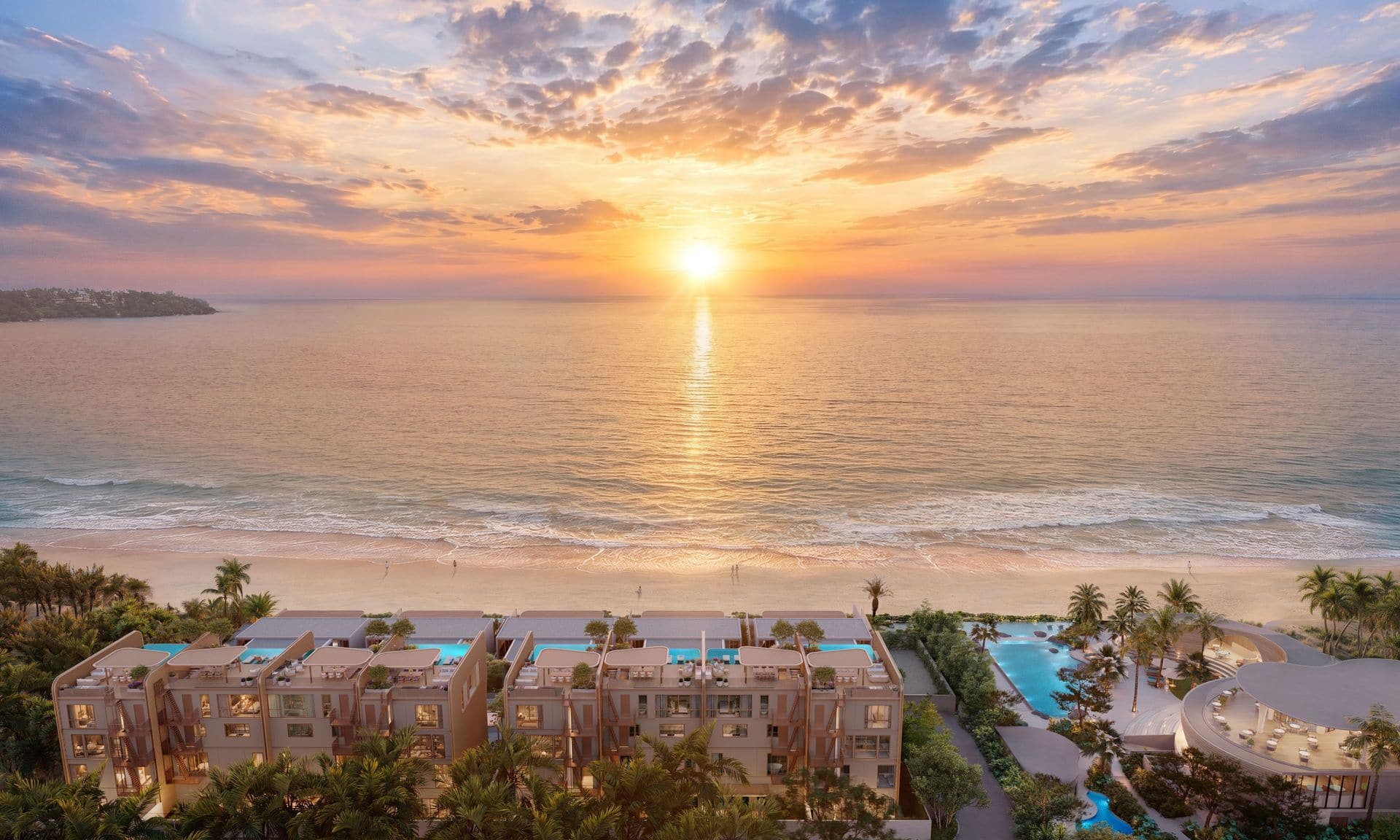Render of Banyan Tree Beach Residences Varuna at sunset from inland: the rooftops of the eight townhomes in front, the Mazu villas and Bang Tao Beach beyond, the sun over the sea