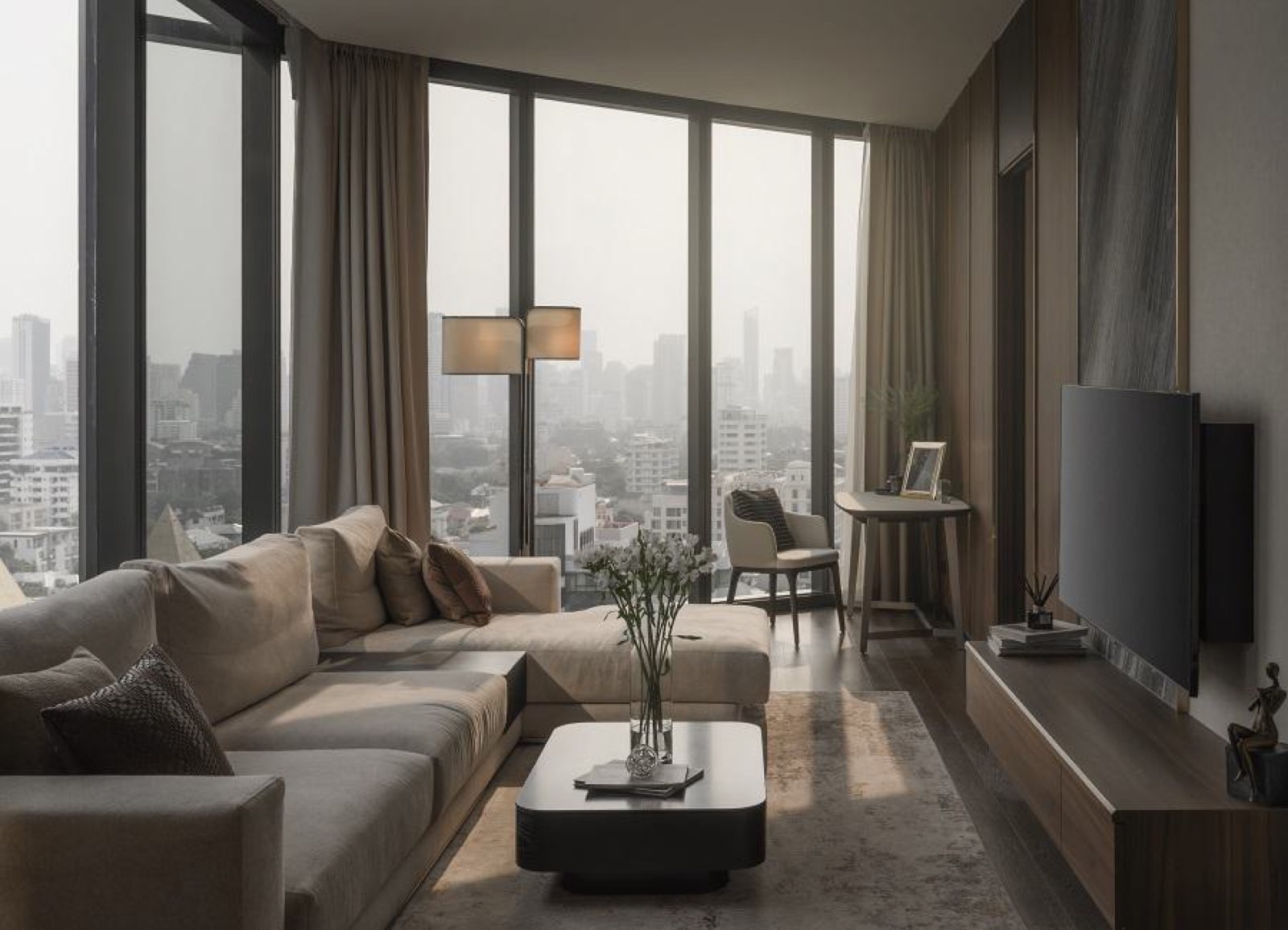 AESTIQ Thonglor: Residence living room with sectional sofa, floor-to-ceiling windows and a misty city view