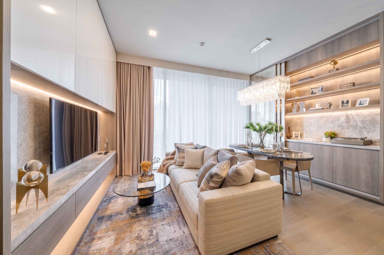 Celes Asoke: living room with marble console and pendant lighting