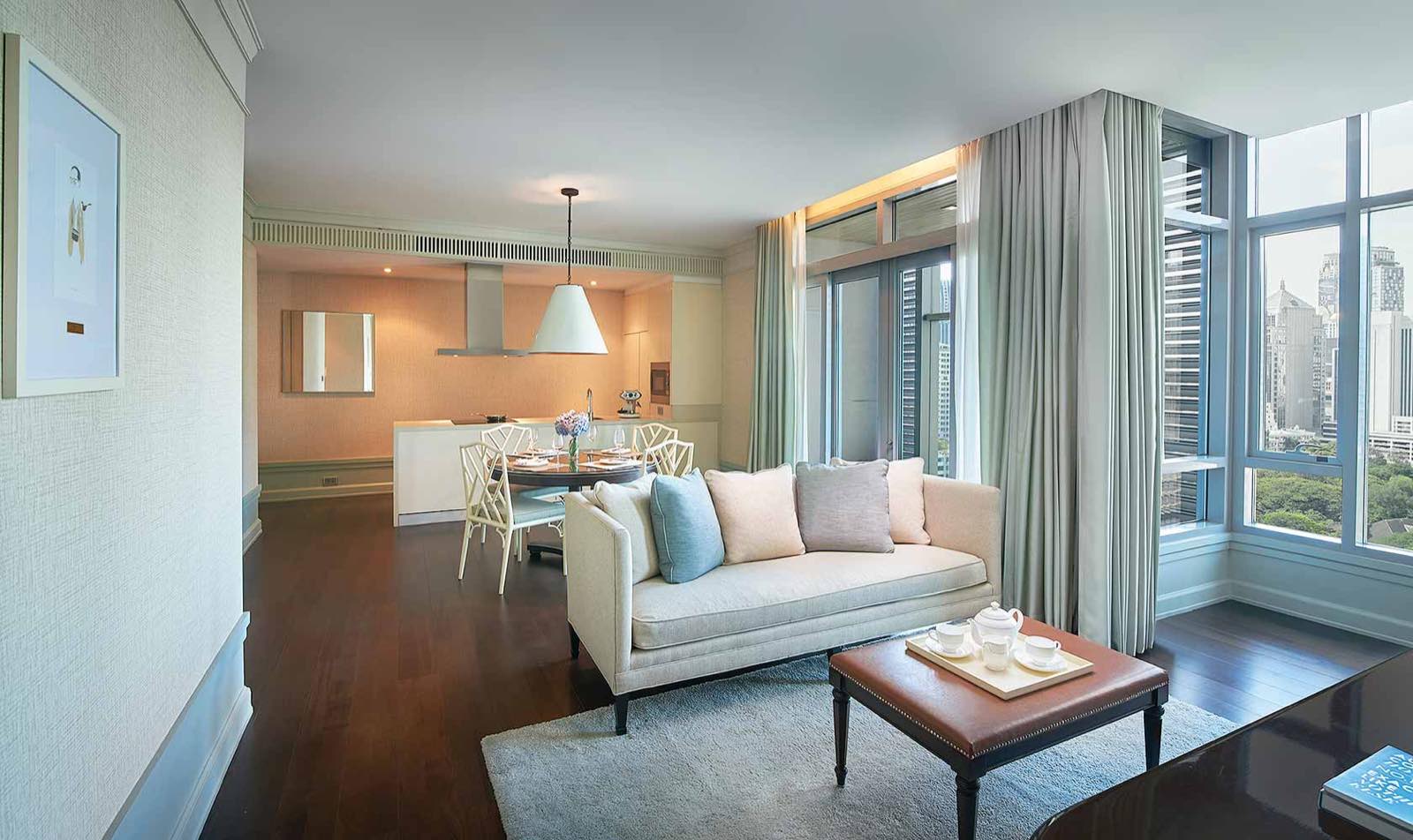 Oriental Residence Bangkok: two-bedroom suite living and dining area with park view