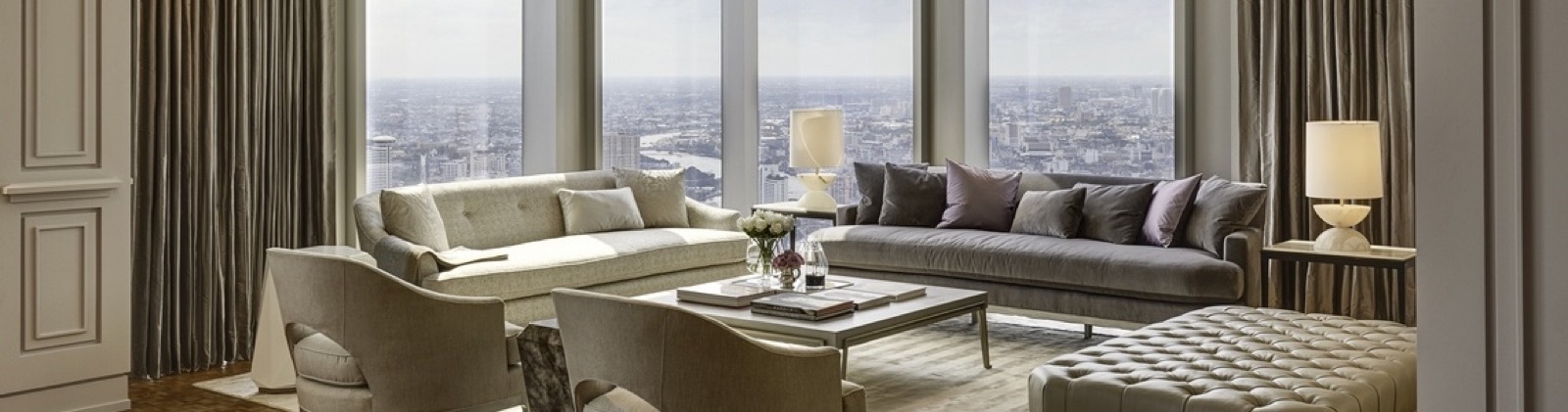 The Ritz-Carlton Residences Bangkok: Ritz-Carlton Sky Residence living room with twin sofas facing floor-to-ceiling windows over the city