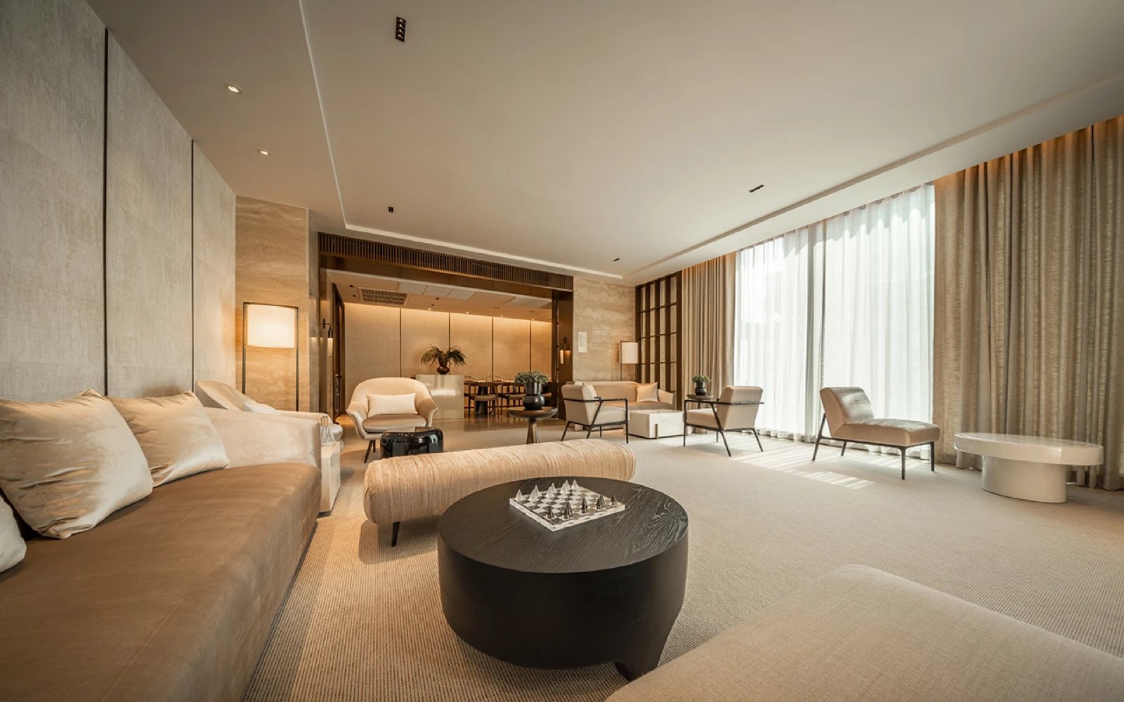 The Strand Thonglor: residence living room interior in warm neutral tones